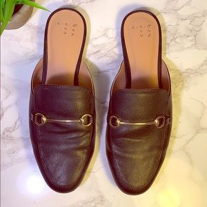 Chic black mules with gold hardware